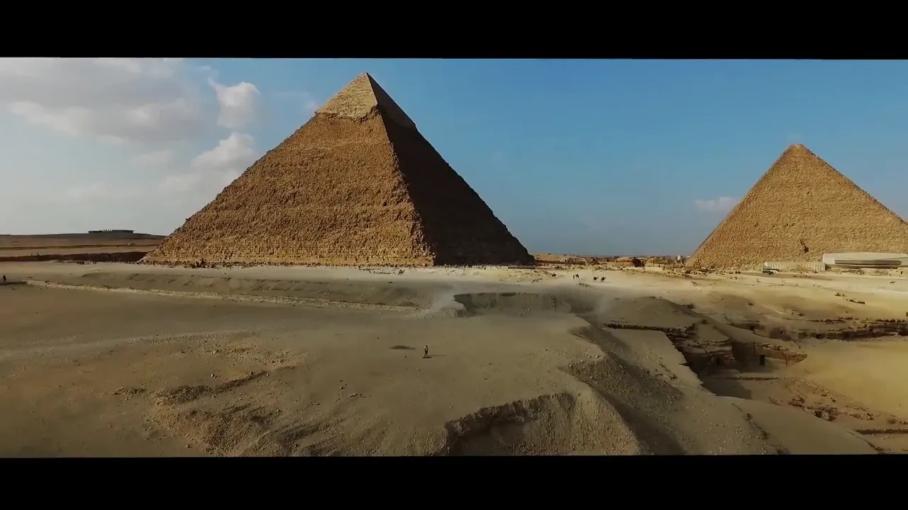 A montage of Egypt: the Pyramids of Giza, temple carvings, desert dunes at dusk, and the Nile